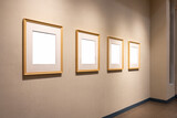 blank picture wooden frames on exhibition wall