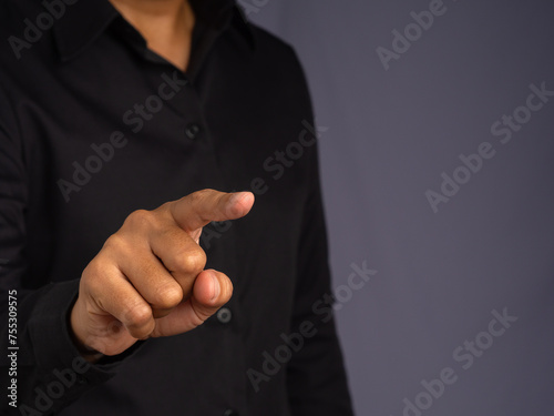 Businessman gestures at the air with his finger.