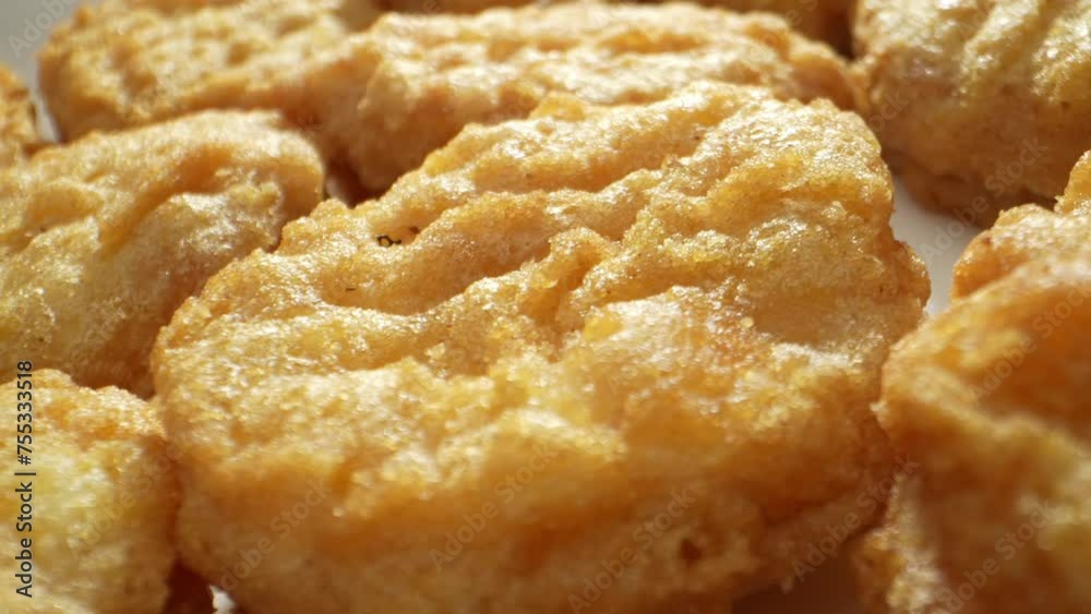 A chicken nugget is a small piece of chicken, breaded or battered, then deep-fried or baked. Popular as a fast food snack or a kid's menu item. Food concept. Fast-food background. 4K HDR.
A chicken nugget is a small piece of chicken, breaded or battered, then deep-fried or baked. Popular as a fast food snack or a kid's menu item. Food concept. Fast-food background. 4K HDR.