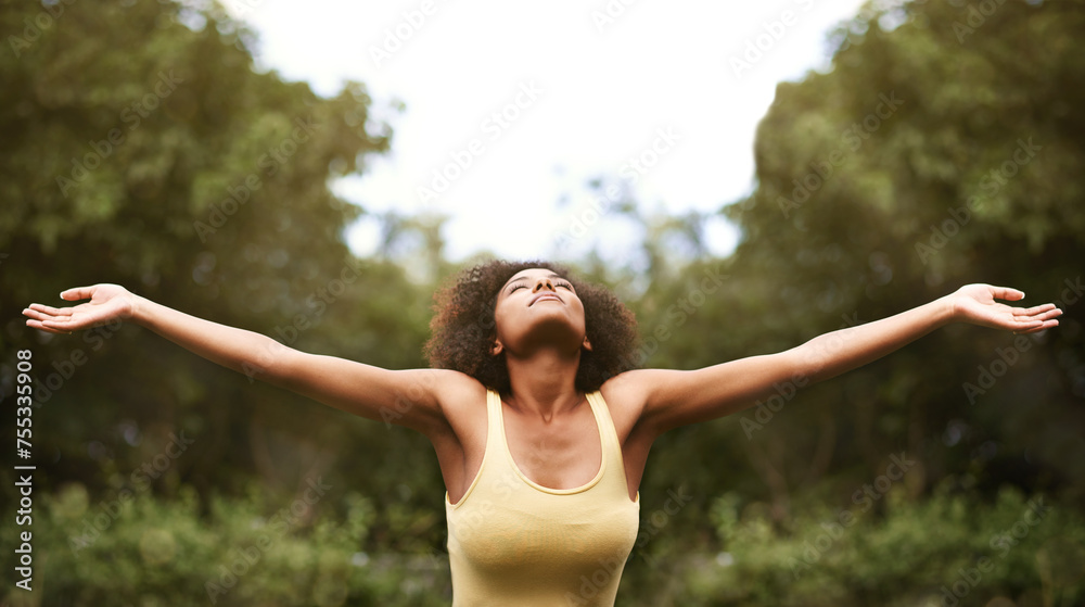 Relax, open arms and black woman in park for freedom, adventure and fresh air in nature. Happy, excited and person with happiness, positive attitude and joy outdoors for holiday, vacation and weekend