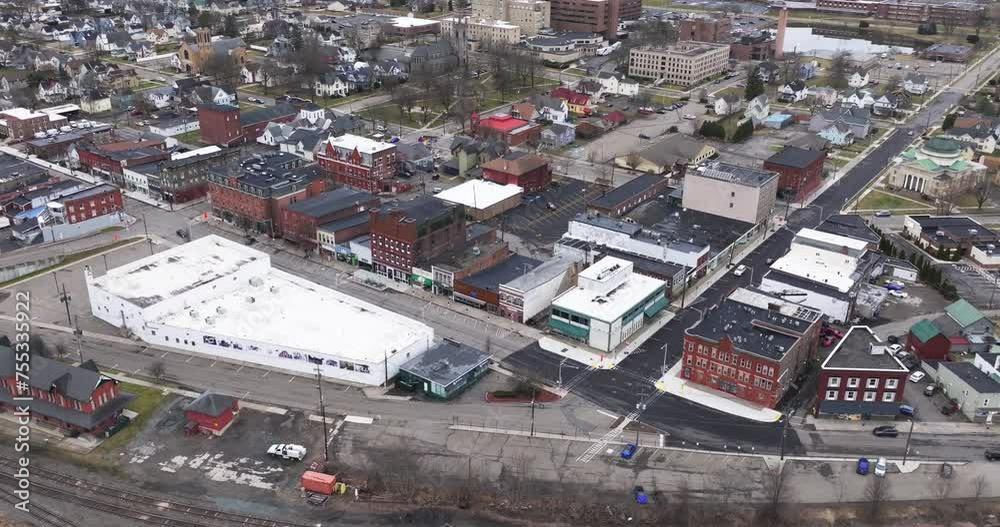 Sayre, PA, USA - 03-03-2024 - Cloudy winter aerial video of the downtown area in the City of Sayre, PA. 
