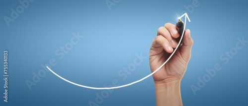 Male hand drawing graph chart showing business profit