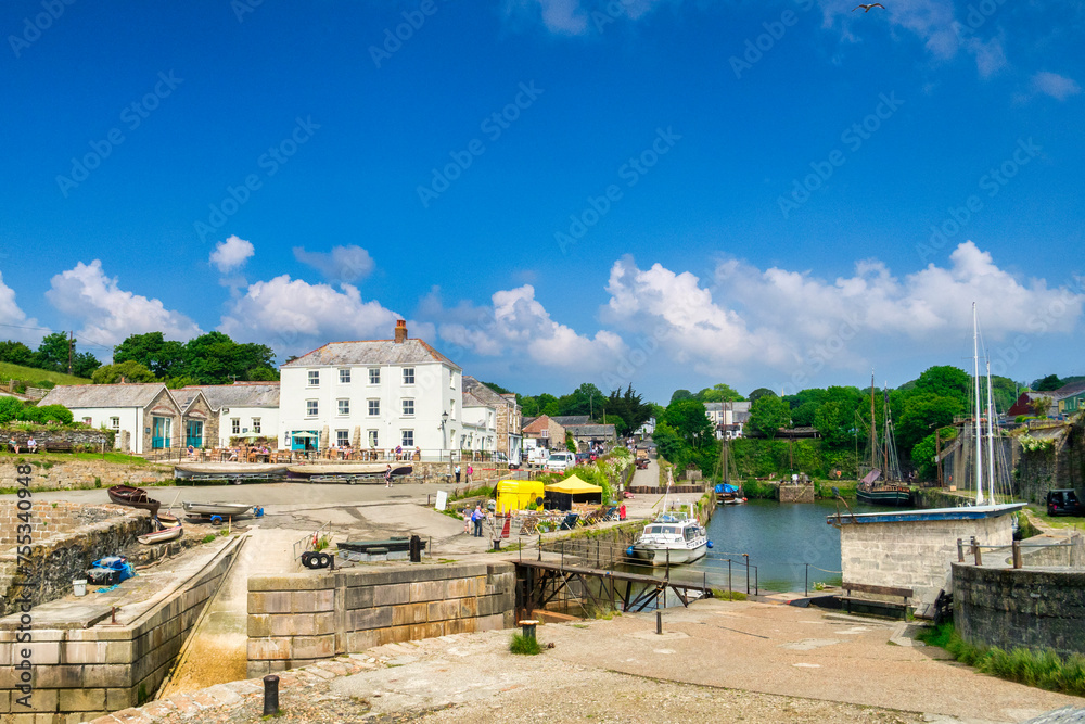 Charlestown, Cornwall, UK - An unspoiled example of a Georgian working port, it was built between 1791 and 1801, and has been used as a location in films and TV. - obrazy, fototapety, plakaty 