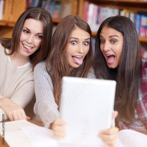 Women, students or tablet selfie in college library or bonding together for crazy update on social media. Learners, touchscreen or post online as goofy friends or solidarity with care in university