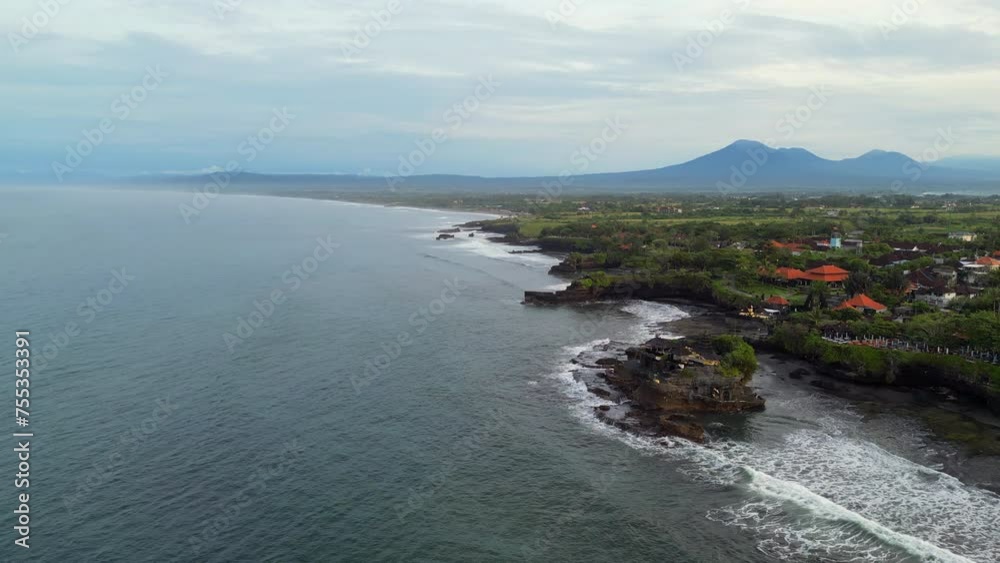 Tanah Lot Temple With Mount Batukaru In The Background In Bali Indonesia Tanah Lot Temple With Mount Batukaru In The Background In Bali Indonesia