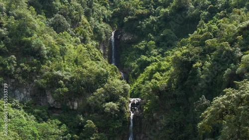 beautiful waterfall of double fall in the middle of the mountain with lush vegetation located in the puichig neighborhood in the city of machachi, in the province of pichincha, Ecuador. photo