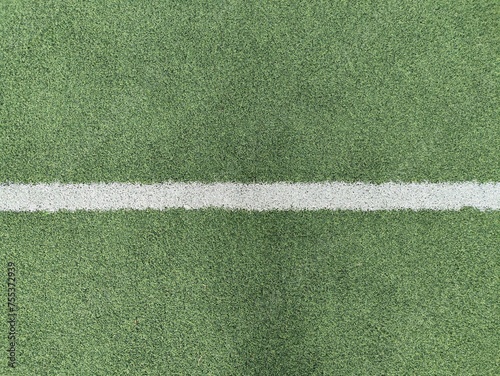 Green synthetic grass with white lines, this grass is usually used for futsal fields