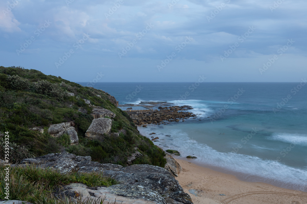 Cloudy view of North Curl Curl rockpool, Sydney, Australia.
