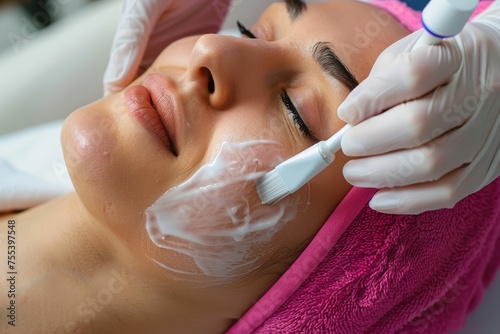 
Photo of a person receiving a facial treatment for acne, such as microdermabrasion or chemical peels photo