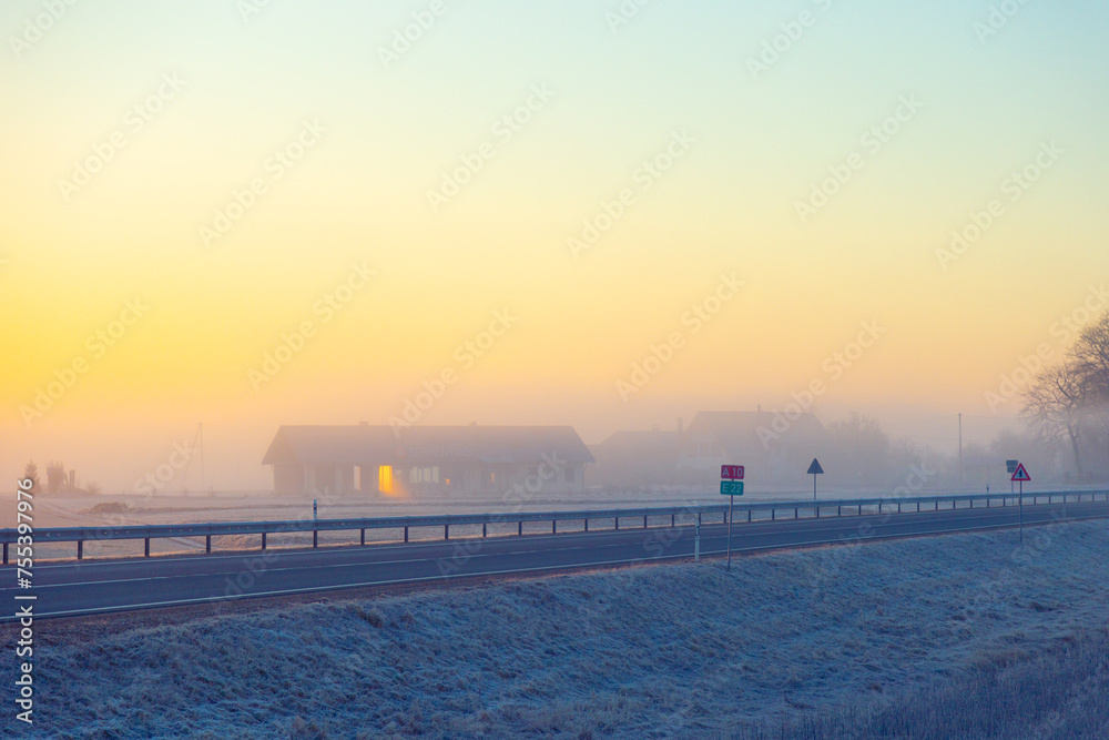 A beautiful foggy morning during early winter. Misty sunrise landscape of Northern Europe.