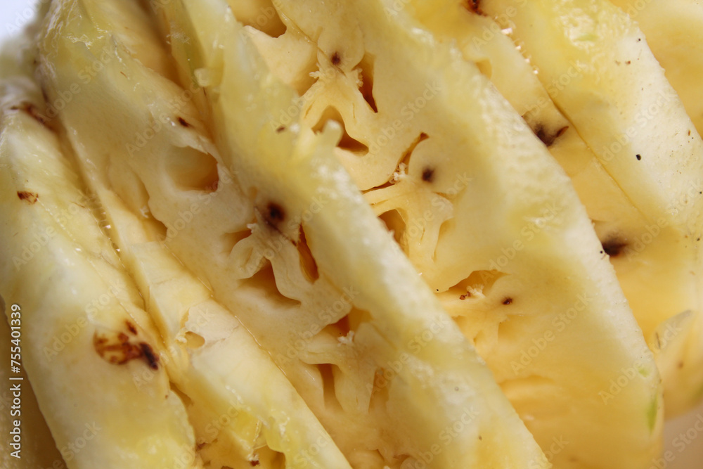 Close-up view of peeled pineapple, as background texture Close-up view of peeled pineapple, as background texture