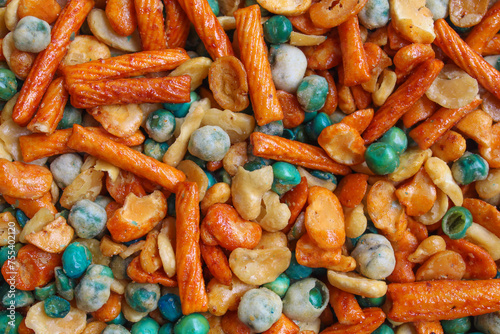 Background texture of mixed peanut and snacks photo