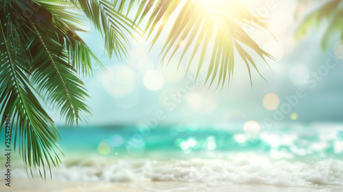 Blurred view of a palm tree standing on a sandy beach, with focus on its trunk, fronds, and coconuts against a clear blue sky. Backdrop, background, wallpaper.