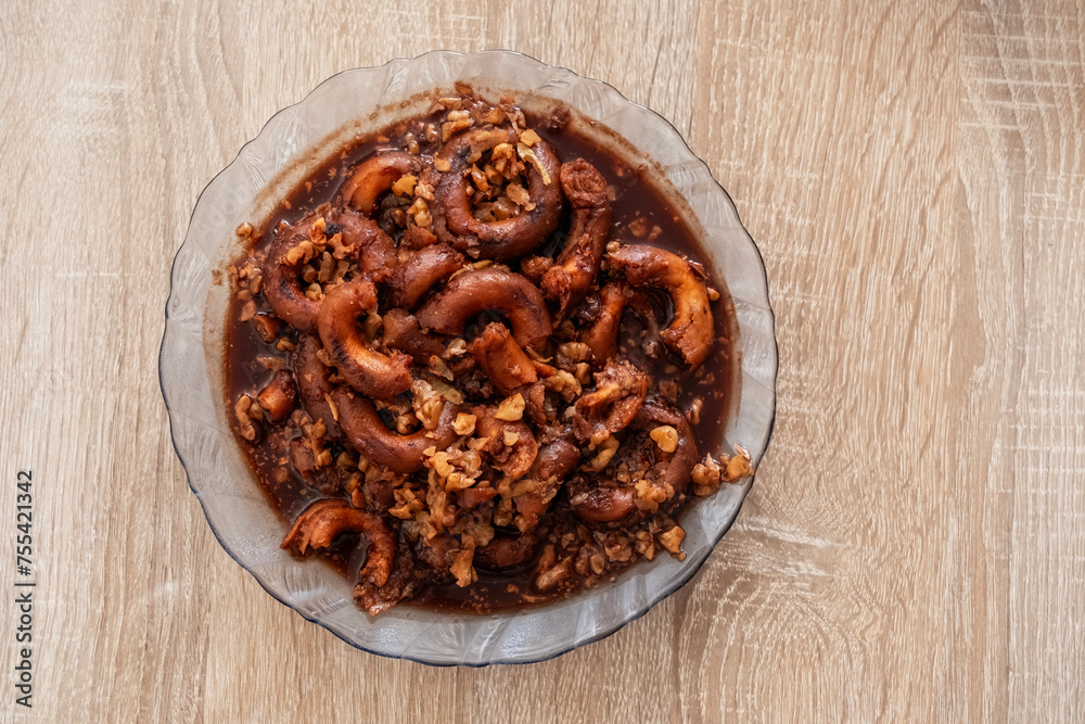 Romanian mucenici or macinici: figure eight shaped pasta, boiled in water with sugar, cinnamon and crushed nuts. Traditional dessert for the Christian feast of the 40 Martyrs of Sebaste Romanian mucenici or macinici: figure eight shaped pasta, boiled in water with sugar, cinnamon and crushed nuts. Traditional dessert for the Christian feast of the 40 Martyrs of Sebaste