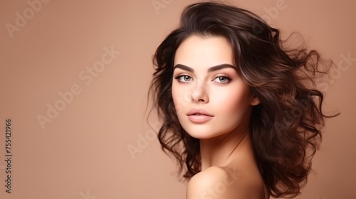 Glamorous Woman With Flowing Hair Against Beige Background