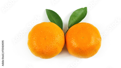 Fresh ripe oranges fruit with green leaves isolated on white background.