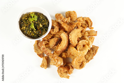 Homemade crispy pork rind isolate on white background. Local food of northern Thailand.