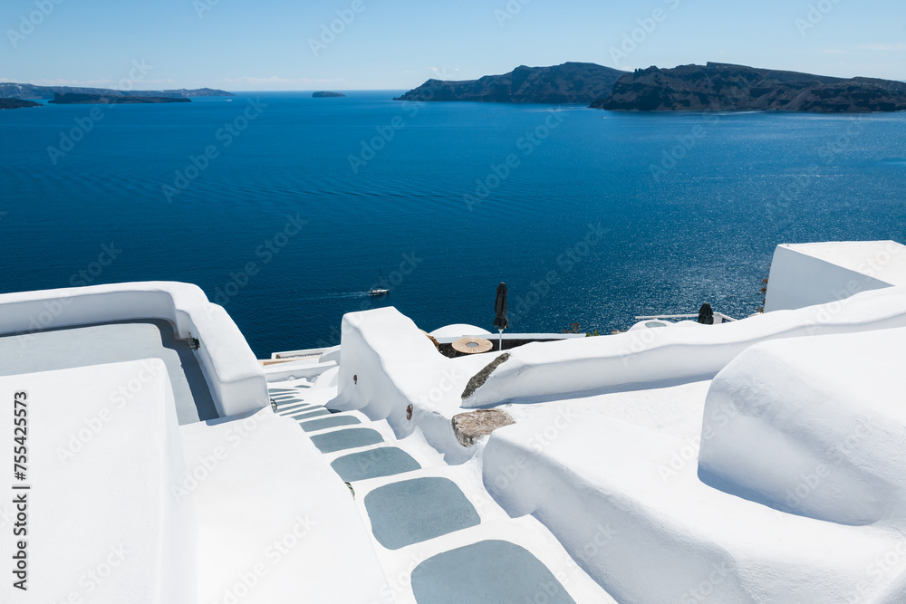 White architecture in Santorini island, Greece. Stairs to the sea.