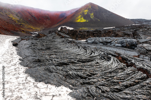 Volcano craters and black lava fields near Tolbachik volcano in Kamchatka, Russia.