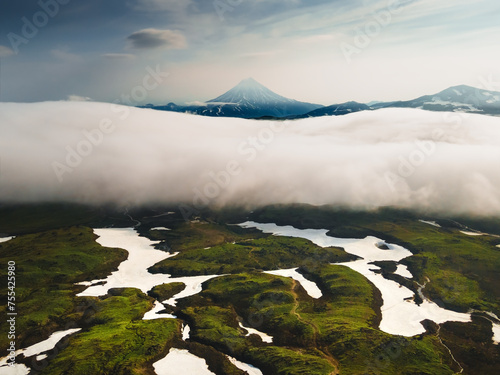 Vilyuchinsky volcano with clouds at sunrise in Kamchatka, Russia. photo