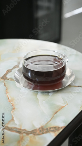 drip coffee in very nice cup on marble table