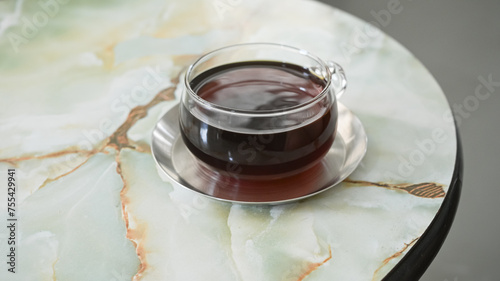 drip coffee in very nice cup on marble table photo