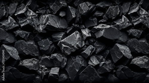 Black coal like rocks form background pattern 