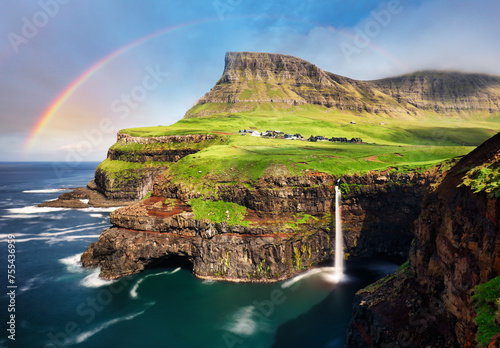 Faroe island landscape - waterfall with rainbow, Denmark