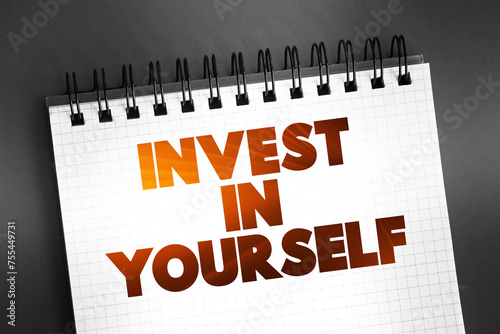 Invest In Yourself text on notepad, concept background