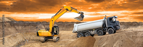 excavator is working and digging at construction site