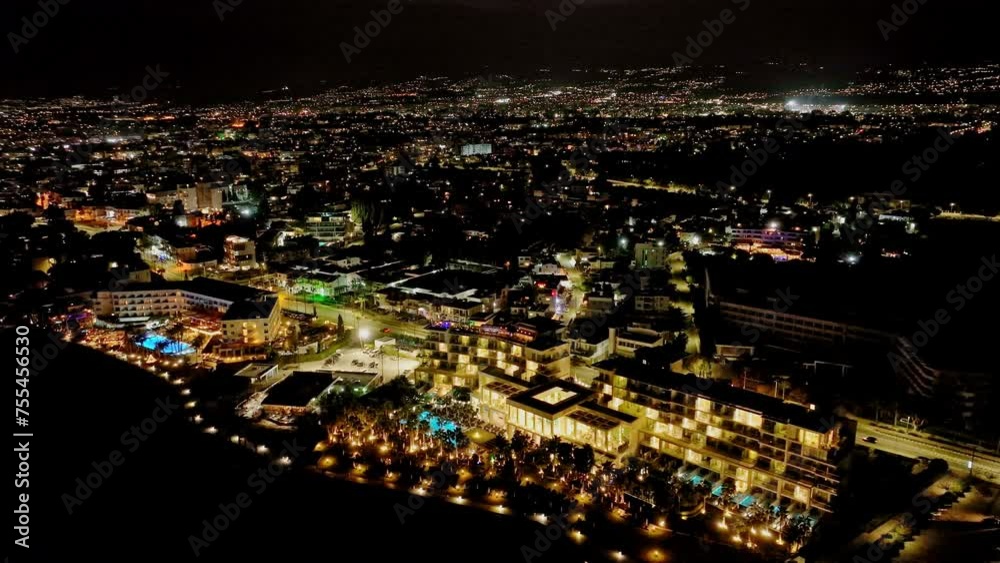 Twilight Radiance: Aerial View of the Captivating Night Cityscape of Paphos, Cyprus, with the Glowing Lights of Street Lamps on the Seafront in this Quaint Tourist Town. High quality 4k footage Twilight Radiance: Aerial View of the Captivating Night Cityscape of Paphos, Cyprus, with the Glowing Lights of Street Lamps on the Seafront in this Quaint Tourist Town. High quality 4k footage