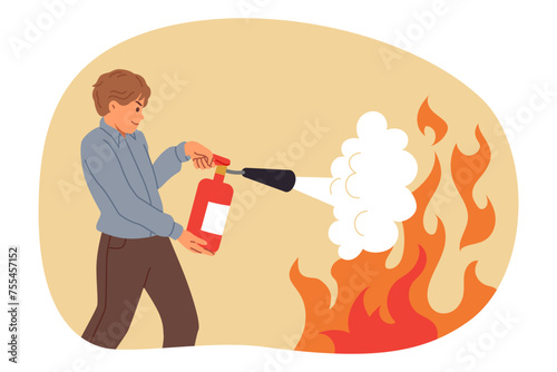 Man uses fire extinguisher, heroically approaching flame and trying to put out source of danger with foam. Guy office worker fights with burning at workspace, holding red fire extinguisher in hands