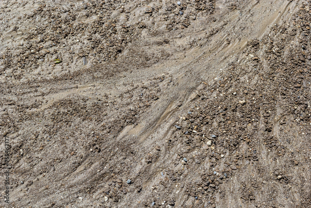 Dirty washed dirt road with traces of water flow in spring. Off-road Dirty washed dirt road with traces of water flow in spring. Off-road