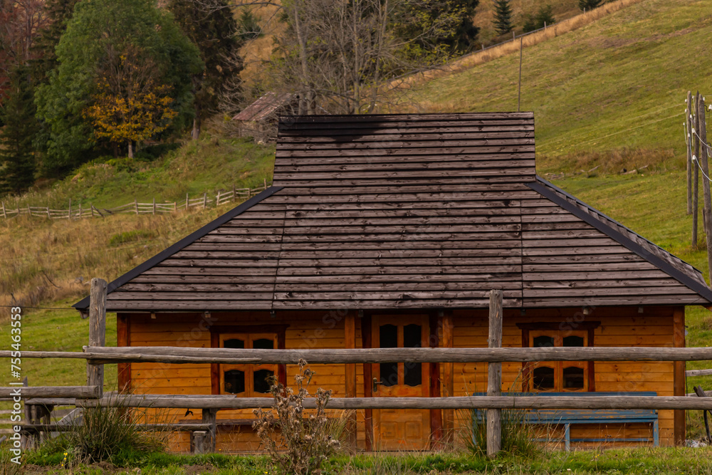 Traditional wooden mountain hut, farm building in the Ukrainian Carpathians Traditional wooden mountain hut, farm building in the Ukrainian Carpathians