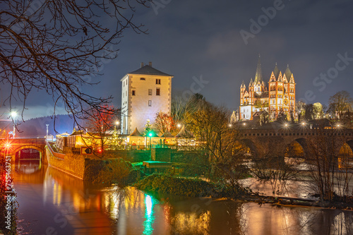 Germany, Hesse, Limburg an der Lahn, Lahn river flowing through city at night