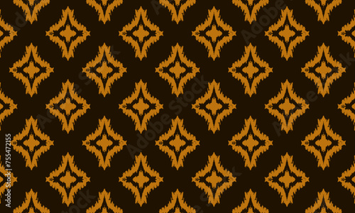 Ikat geometric folklore ornament. Tribal ethnic vector texture. Traditional Indonesian Batik seamless pattern.  Ethnic printing fabric textile vector. Bohemian fashion. Asian culture motif