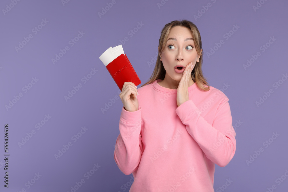 Emotional young woman with passport and ticket on purple background, space for text Emotional young woman with passport and ticket on purple background, space for text