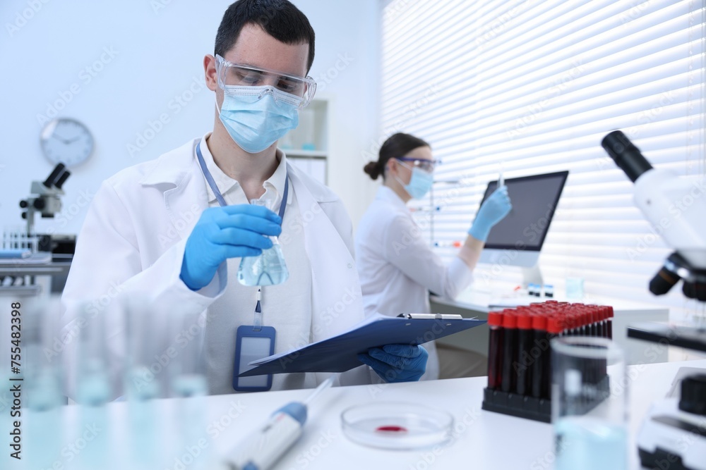 Scientists working with samples in laboratory. Medical research Scientists working with samples in laboratory. Medical research