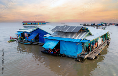 Village on the water of Tonle Sap lake in Cambodia. Beautiful lighting, sunset.