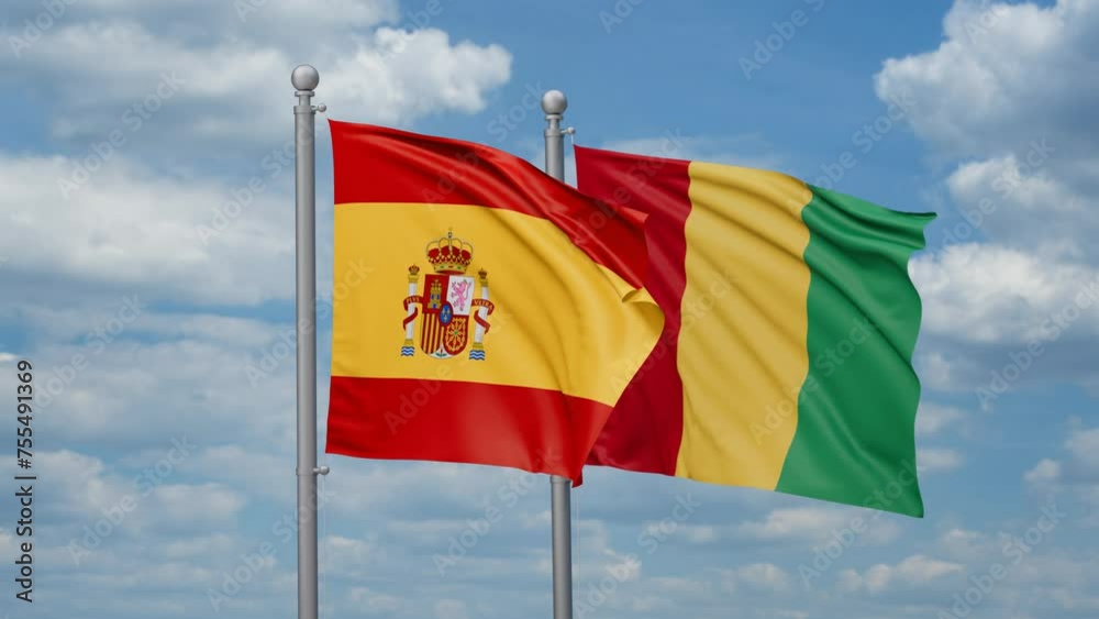 Republic of Guinea and Spain two flags waving together, looped video, two country relations concept Republic of Guinea and Spain two flags waving together, looped video, two country relations concept