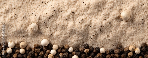 Milled white pepper powder pile, peppercorn background and texture