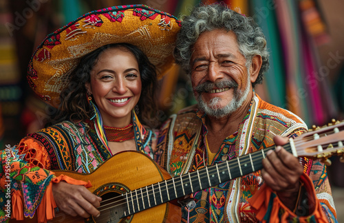 Joyful musicians in traditional Mexican attire with a guitar, sharing a moment of cultural celebration.
