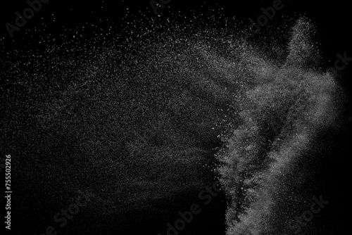 Abstract white dust on black background. Light smoke texture. Powder explosion. Splash water overlay.  