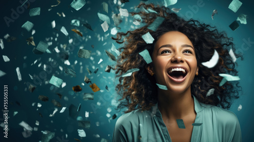 Excited woman in a confetti shower as a giveaway concept © Robert Kneschke
