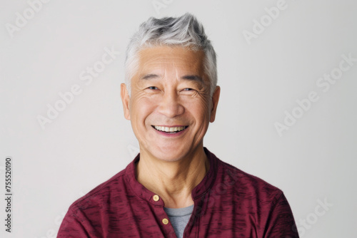 Portrait of old healthy, cheerful handsome Asian senior man smiling and looking at camera with white background. Happy aging society, retirement, teeth, health and senior healthcare concept