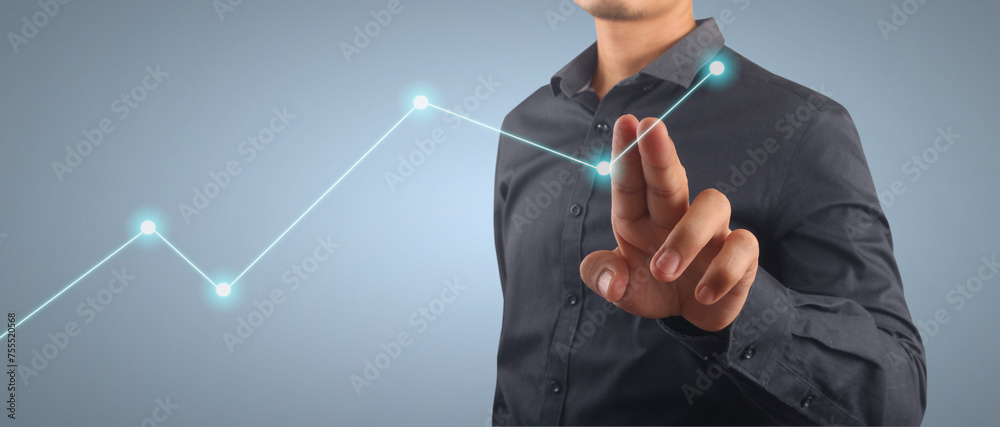 Businessman plan graph growth and increase of chart positive indicators in his business Businessman plan graph growth and increase of chart positive indicators in his business