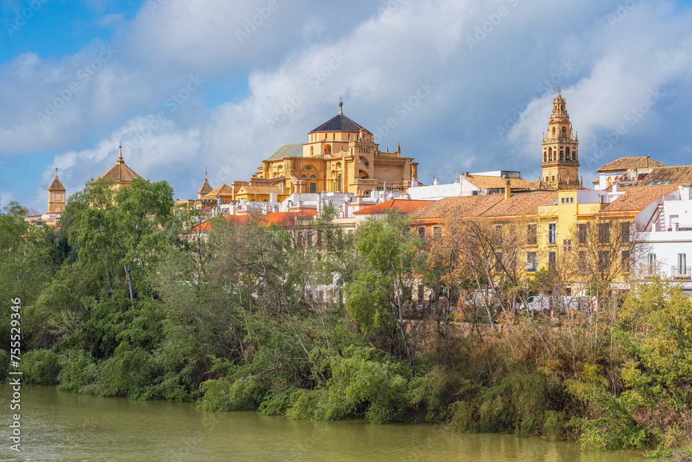Fototapeta premium View of Córdoba city in Andalusia featuring the River Guadalquivir and the Mosque-Cathedral
