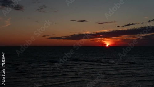 A wonderful sunset over the Baltic Sea on a summer evening. Time lapse