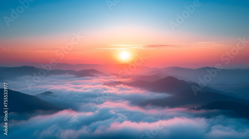 serene sunrise over a misty mountain range © SS Digital