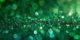 Green and turquoise bokeh lights shimmering on a dark background, depicting calmness and digital wallpaper aesthetic.